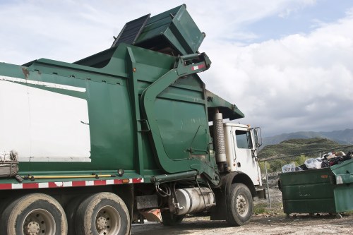 Construction workers managing waste on site